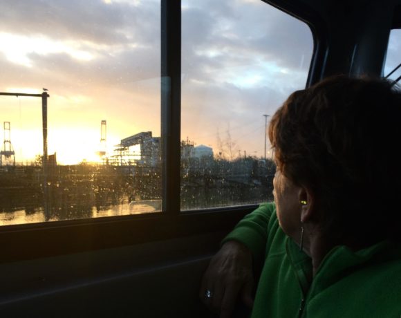 Sheri Tonn, with Citizens for a Healthy Bay, looks at the old Occidental Chemical Corporation site from a boat on the Hylebos Waterway. For decades the facility produced drycleaning solvents and other chemicals that have slowly leached underground. CREDIT: COURTNEY FLATT/NWPB