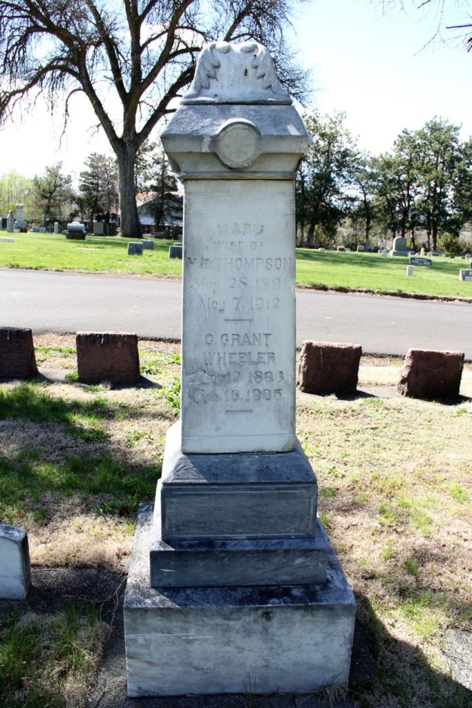 The grave stone where Logan’s mother, father, brother, and sister are buried. Pictured: the names of his sister and brother. On the left, Logan’s mother and on the right, his father. The fourth side, where Logan’s name might have rested, is blank.