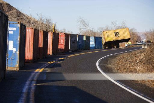 Crews arrange large containers along Thorpe Road near Rattlesnake Ridge south of Union Gap, Wash., Wednesday, Jan. 3, 2018. The containers will be filled with concrete barriers in an effort to keep rocks and other debris from falling onto Interstate 82. (Shawn Gust/Yakima Herald-Republic/via AP)Crews arrange large containers along Thorpe Road near Rattlesnake Ridge south of Union Gap, Wash., Wednesday, Jan. 3, 2018. The containers will be filled with concrete barriers in an effort to keep rocks and other debris from falling onto Interstate 82. (Shawn Gust/Yakima Herald-Republic/via AP)