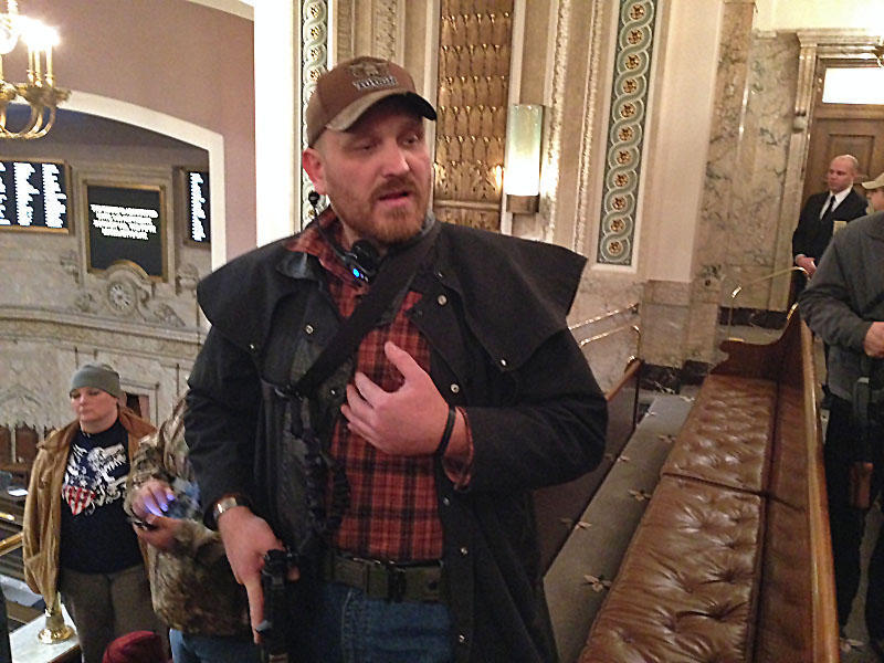 Jason McMillan carrying a firearm in the Washington House gallery in 2015. Beginning in January of 2018, all guns will be banned from the Senate gallery. AUSTIN JENKINS/NORTHWEST NEWS NETWORK