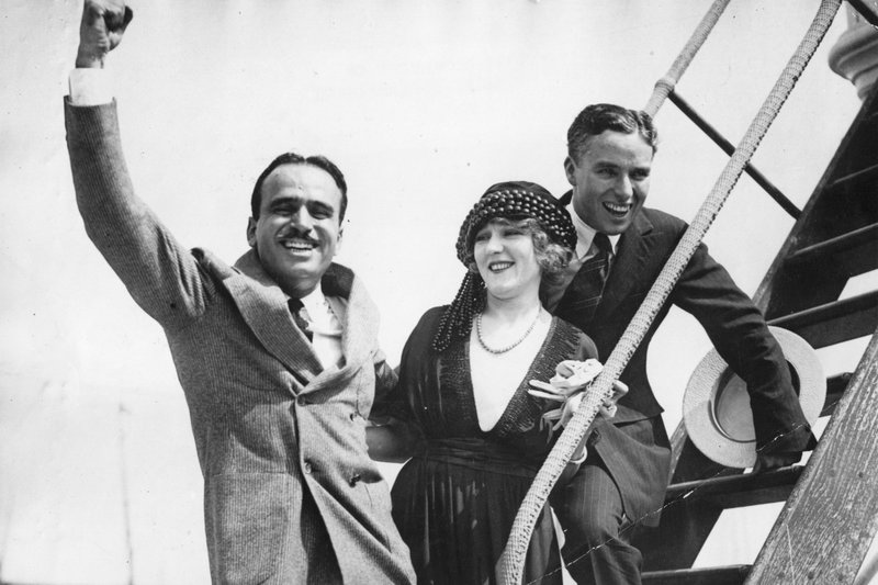 Pickford (center) created United Artists with Douglas Fairbanks (left), Charlie Chaplin (right) and D.W. Griffith (not pictured). CREDIT: GETTY IMAGES