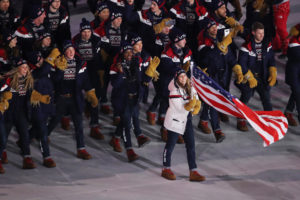 Flag bearer Erin Hamlin of the United States leads the team in the Parade of Athletes. CREDIT: SEAN M. HAFFEY/GETTY IMAGES
