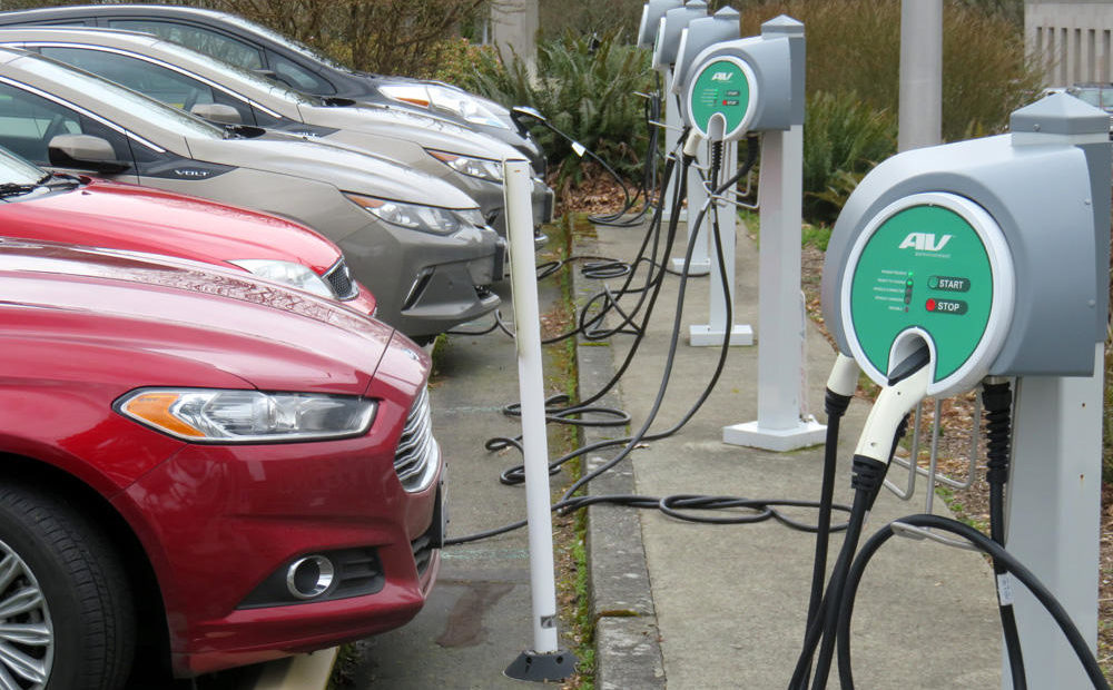 Plug-in cars charge up at the Washington State Capitol Campus. A disproportionately high number of the state's legislators drive electric vehicles compared to the general population. CREDIT: TOM BANSE