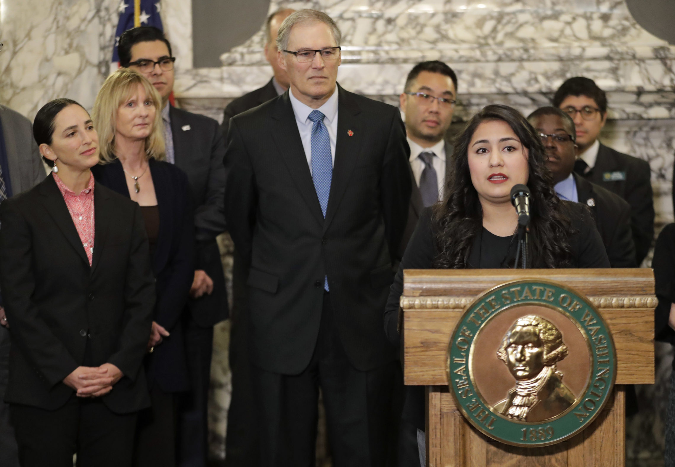 Dulce Gutierrez, right, Assistant Mayor of Yakima, speaks Jan. 5, 2018, during a news conference at the Capitol in Olympia about the need to address voter access in the state.