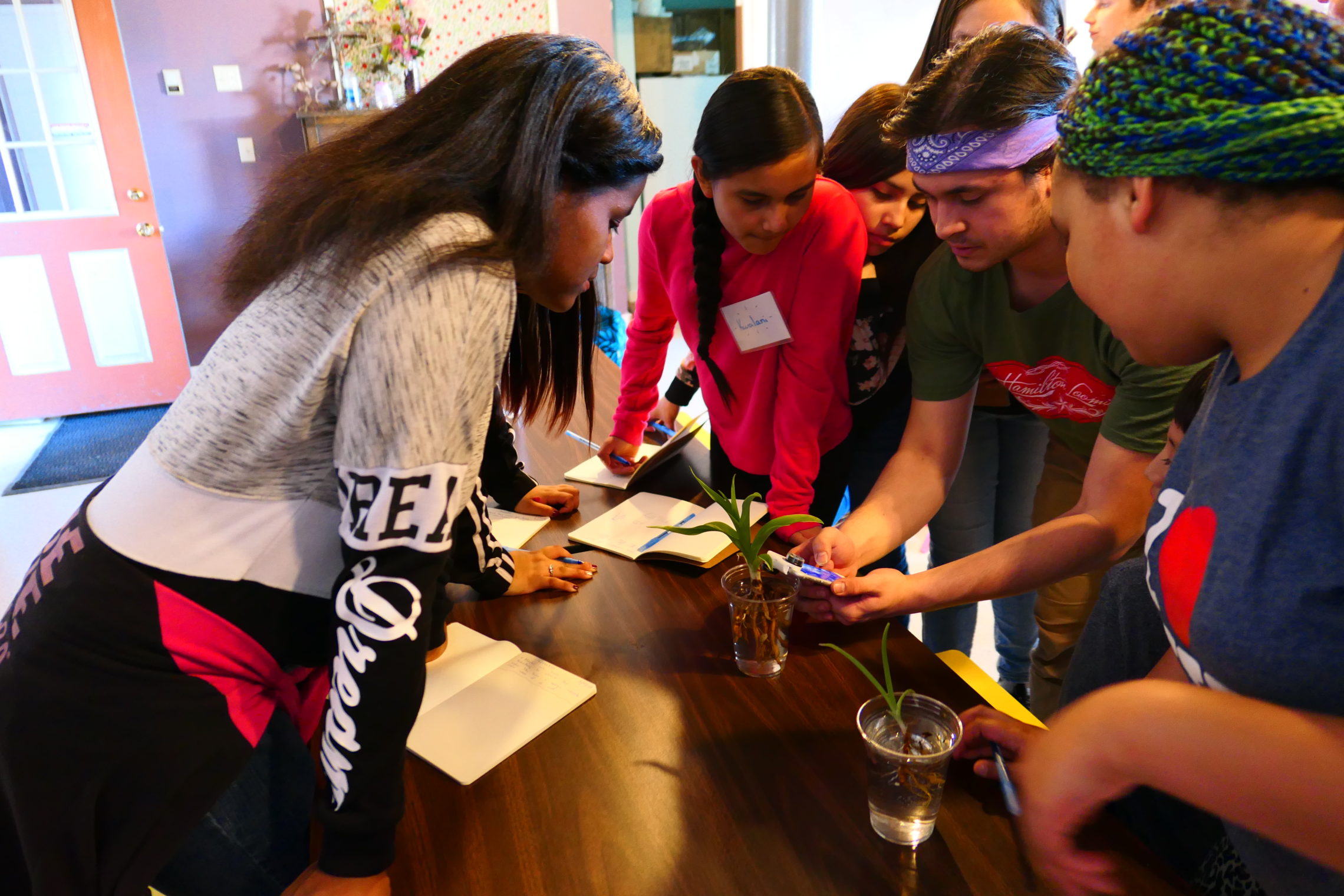 UW student Joshawah Eagle-Bear (center right) leads 6th grade students on a workshop titled "Water Is Life" at Campbell Farm in Wapato, Wash. CREDIT: ZIHAN CAO
