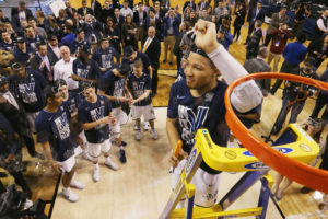 Jalen Brunson of Villanova cuts the net after defeating Texas Tech 71-59 in the 2018 NCAA Men's Basketball Tournament to advance to the Final Four. CREDIT: ELSA/GETTY IMAGES