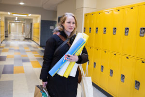 Maggie Webb, who teaches eighth-grade math, heads home from Clark Avenue School in Chelsea, Mass. CREDIT: KAYANA SZYMCZAK
