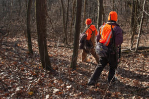 Emily Iehl and Beth Wojcik set out to find an open spot to sit and wait for moving deer. Iehl, who works with Wisconsin's DNR is mentoring Wojcik, who has never killed a deer before. CREDIT: NATHAN ROTT