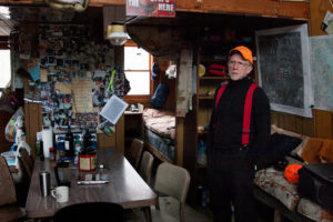 Tom Wrasse is alone at his hunting shack on the last day of a deer hunting season. 