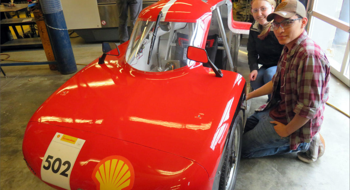 Granite Falls High School Eco Car Team drivers Kelsey and Dimitri beside their ''UrbanConcept'' vehicle. CREDIT: TOM BANSE