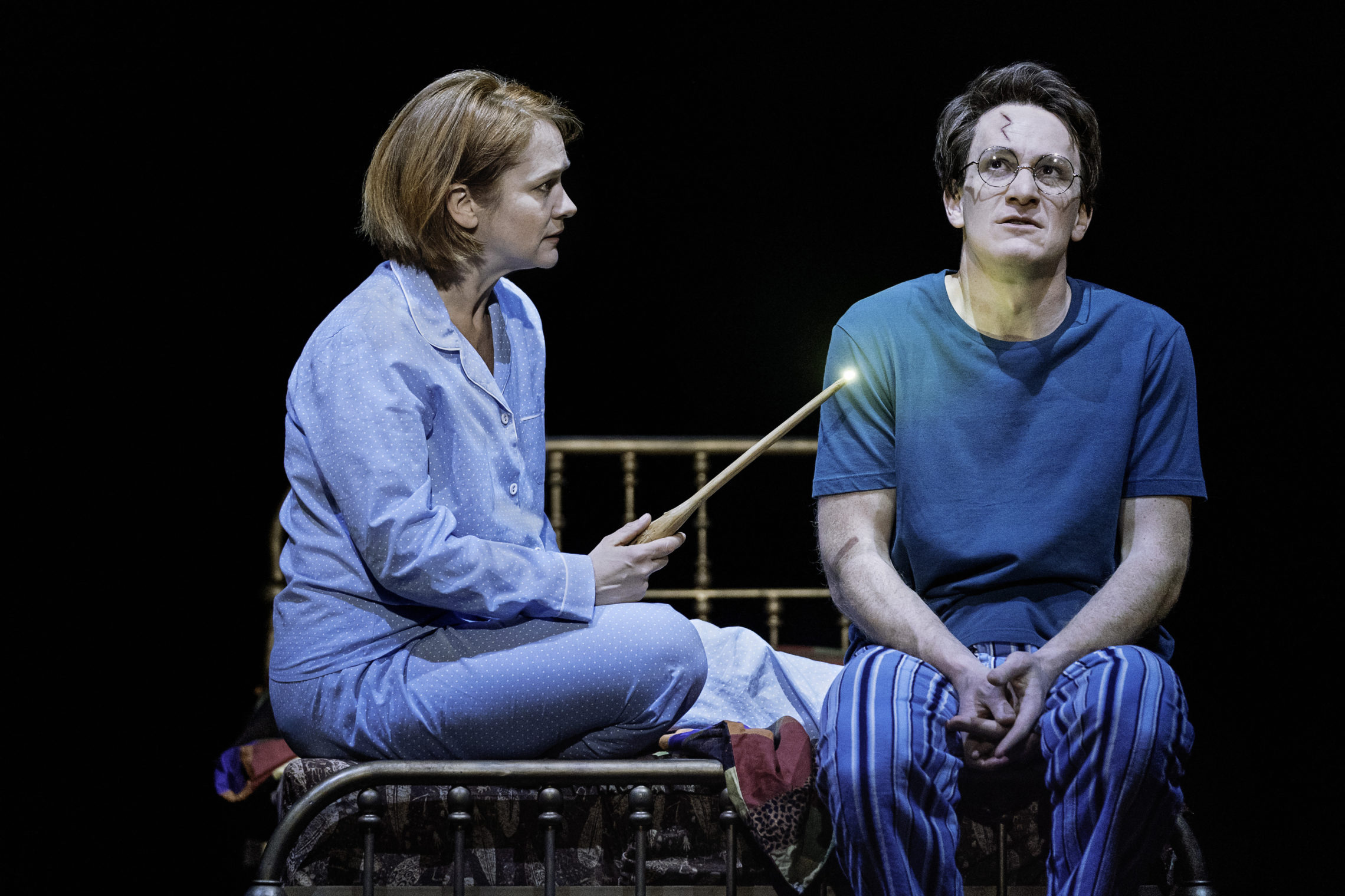 Jamie Parker plays Harry Potter, and Poppy Miller plays his wife, Ginny, in Harry Potter and the Cursed Child. CREDIT: MANUEL HARLAN