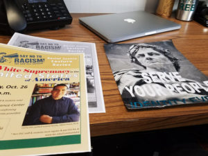 Flyers for Ponce's talk about white supremacy in the United States sit next to a flyer for Identity Evropa, a white supremacist group. CREDIT: ANYA KAMENETZ