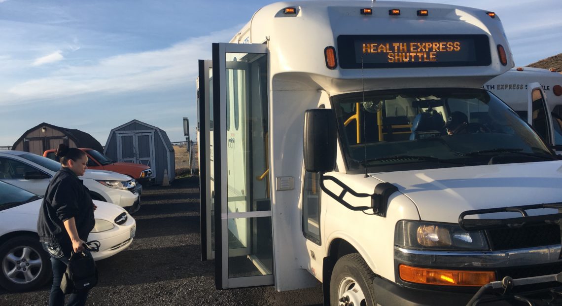 Rosenda Henley, People for People's mobility manager boards the Health Express. The bus will travel almost 70 miles from Moses Lake to Wenatchee, with stops at local hospitals and senior centers.