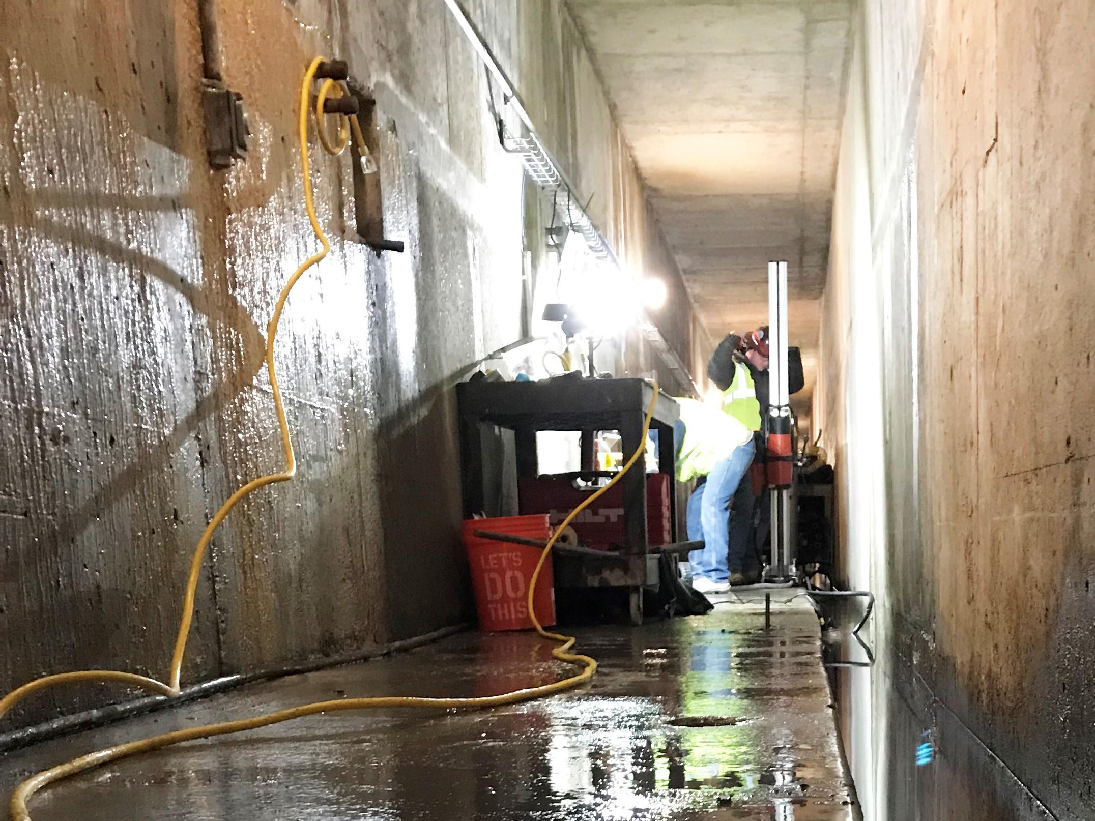 Workers drill core samples in the grout galleries of Priest Rapids Dam in southeast Washington to figure out how extensive leaking is in the structure’s spillway. CREDIT: GRANT PUBLIC UTILITY DISTRICT