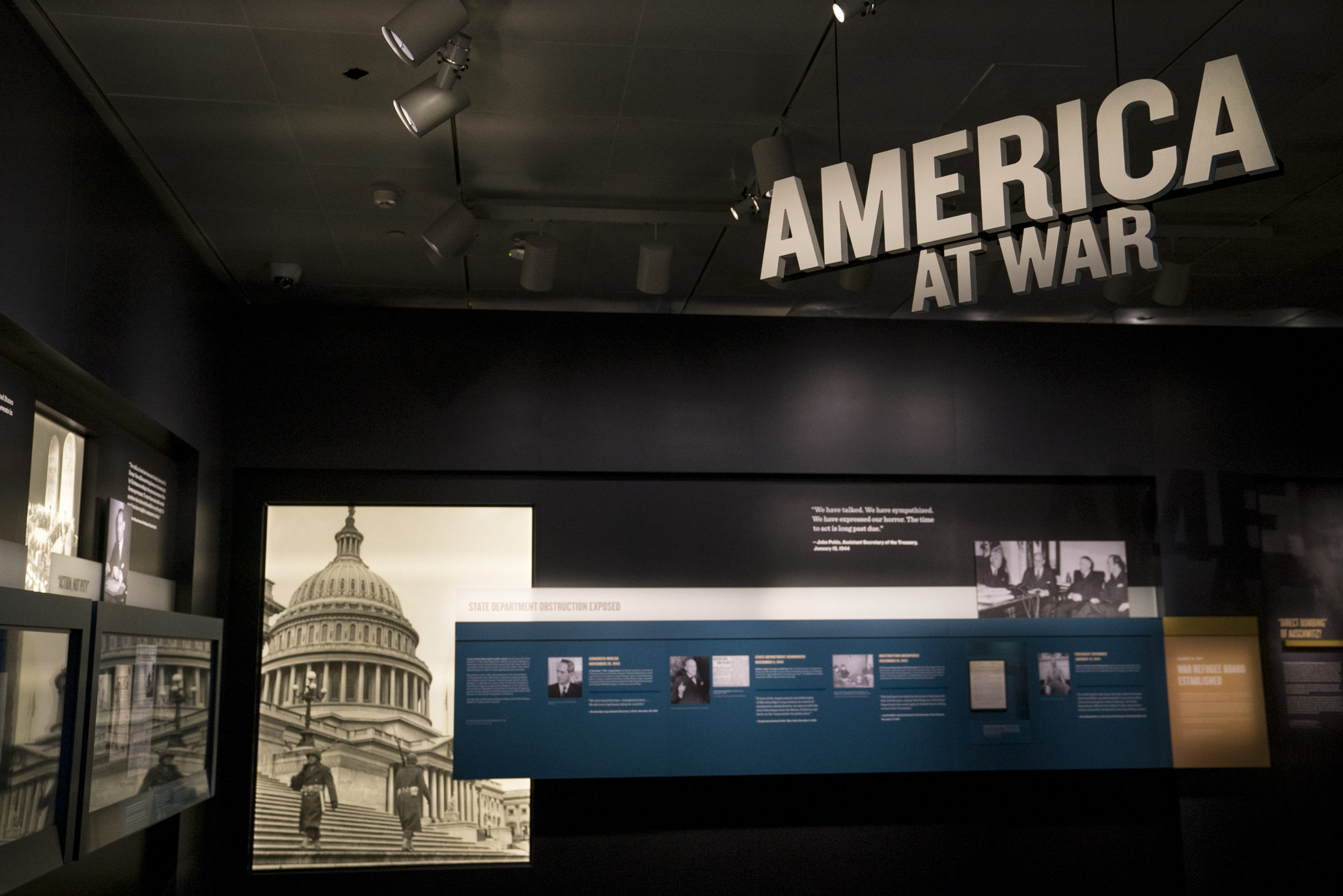 Scattered throughout the exhibit, rotating blocks with public opinion polls question U.S. engagement with war, refugees and persecuted people. CREDIT: ESLAH ATTAR