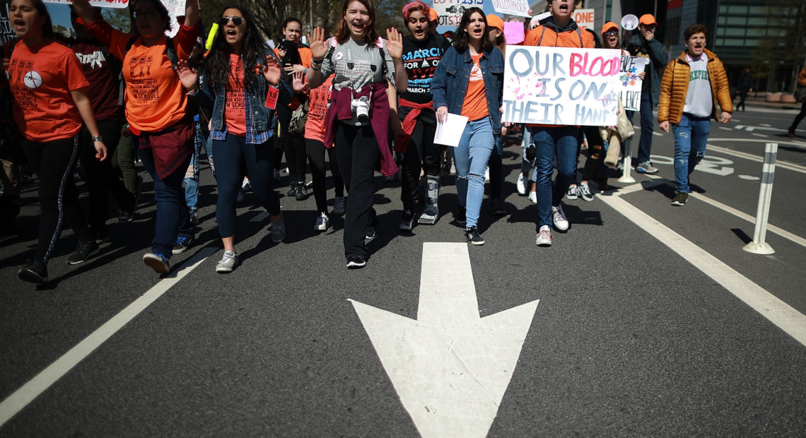 High school students march from the White House to the U.S. Capitol to call for stricter gun laws on Friday in Washington, D.C.