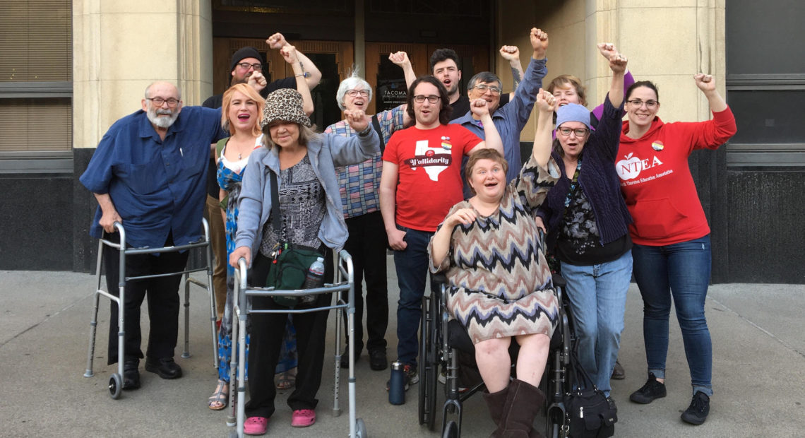 Tiki Apartments residents and supporters after a Tacoma City Council meeting on April 26. Courtesy of Tiki Tenants Organizing Committee