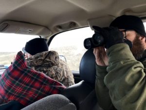 Todd Stansbery, right, and Zach Slick watch the raven traps they just set. They are helping out with research looking into how ravens are affecting sage grouse near Baker City, Oregon. CREDIT: COURTNEY FLATT