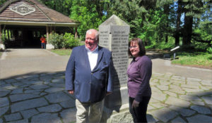 Greg and Rachel Leo pose beside the monument at the site of the historic vote at Champoeg, Oregon. CREDIT: TOM BANSE