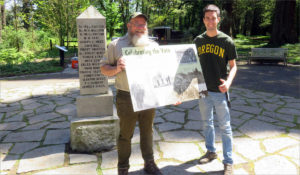 Tim Lussier of West Linn, Oregon, at right, is one of hundreds of descendants of the territorial government founders living in the Pacific Northwest today. His ancestor, Etienne Lucier, cast a deciding vote here in 1843. Park ranger Dan Klug holds a new interpretive panel. CREDIT: TOM BANSE
