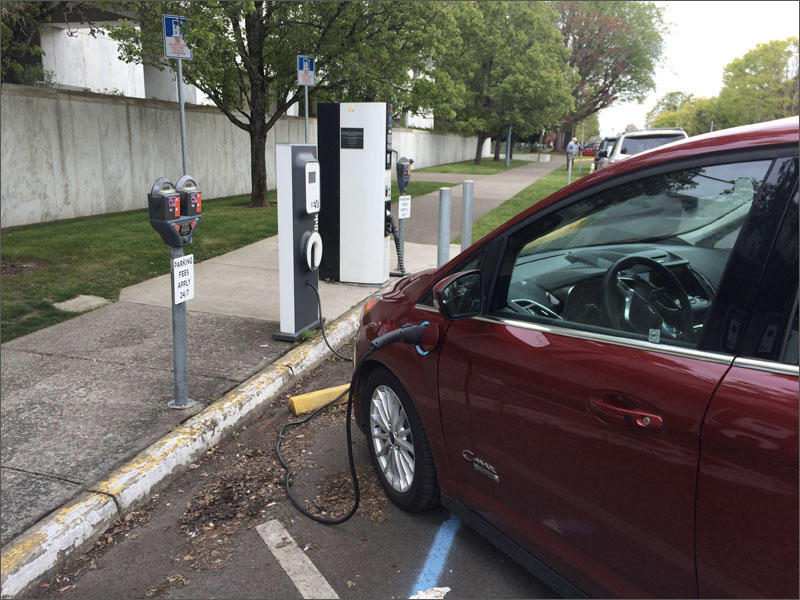 File photo of an electric vehicle charging up outside of the Oregon Capitol. CREDIT: CHRIS LEHMAN