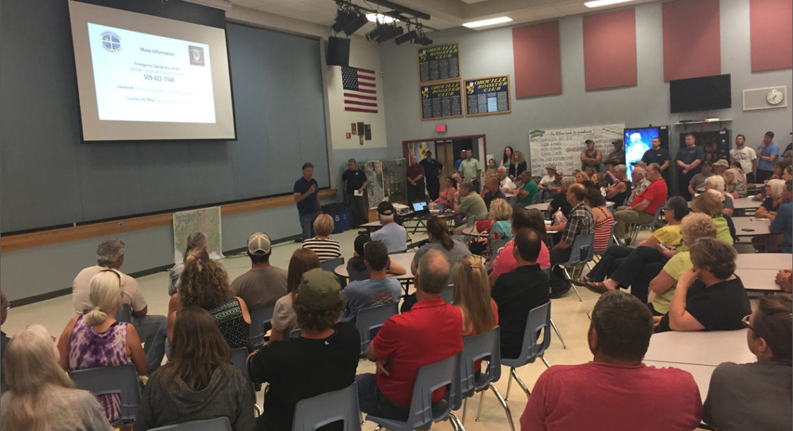 Roughly 200 people attended a public meeting at the high school in Oroville. They were briefed by emergency managers on flooding in the Okanogan Valley. CREDIT: EMILY SCHWING