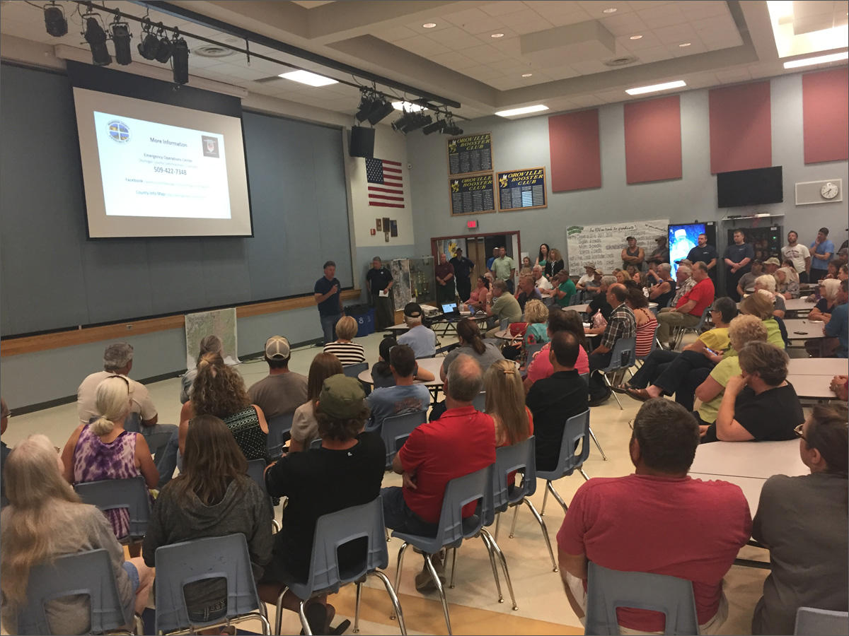 Roughly 200 people attended a public meeting at the high school in Oroville. They were briefed by emergency managers on flooding in the Okanogan Valley. CREDIT: EMILY SCHWING
