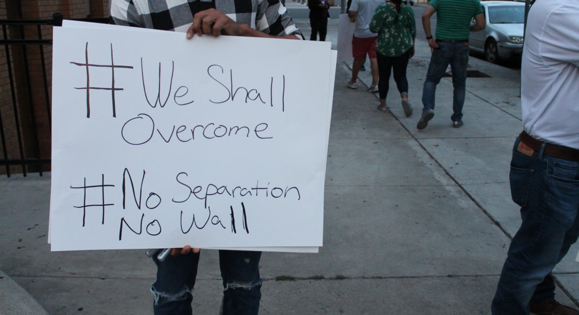 A protester outside the Yakima County Jail Wednesday, June 27 joins several others in calling for the release of detained immigrants. CREDIT: ESMY JIMENEZ/NWPB