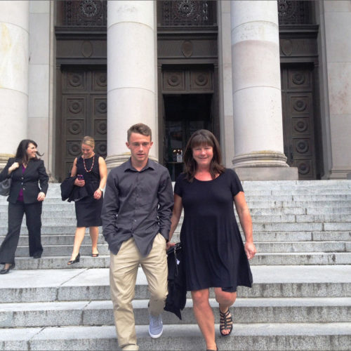 In this 2016 file photo, Stephanie McCleary and her son, Carter, leave the Washington Supreme Court following a hearing in the nearly decade-old school funding lawsuit that bears their name. CREDIT: AUSTIN JENKINS