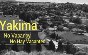 Black and white photo of a Yakima neighborhood with text saying no vacancy