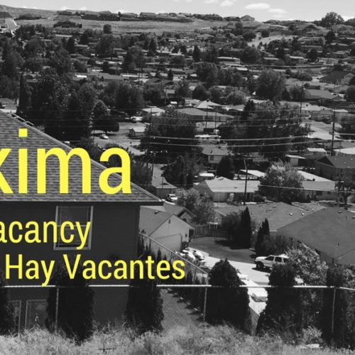 Black and white photo of a Yakima neighborhood with text saying no vacancy