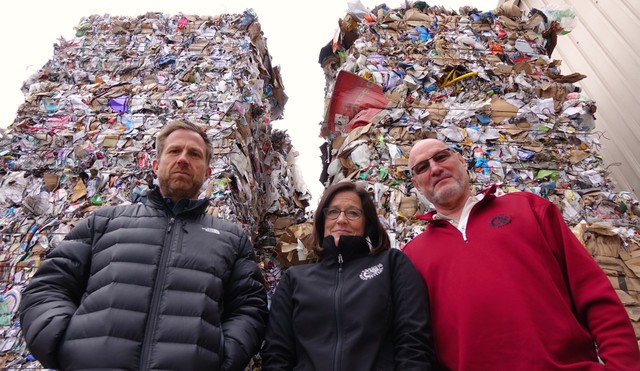 Rogue Waste System’s Scott Fowler (left) and Laura Leebrick (center) have nowhere to send about 2,000 tons of baled and stacked of co-mingled recycling. CREDIT: JES BURNS