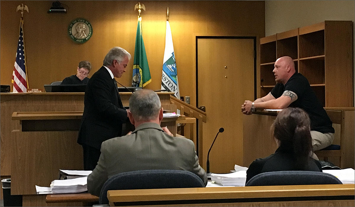 Attorney Scott Milburn cross examined Mike Mesa Thursday about Mesa's observations during an Animal Services raid in Olympia on Easter weekend. CREDIT: TOM BANSE