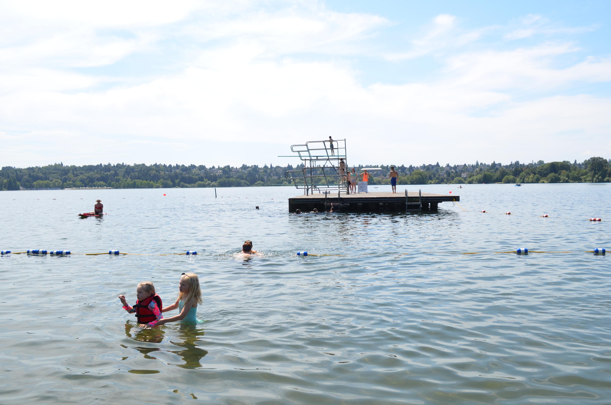 Kids take a dip in Green Lake. CREDIT KUOW-EARTHFIX PHOTO/EILIS O'NEILL