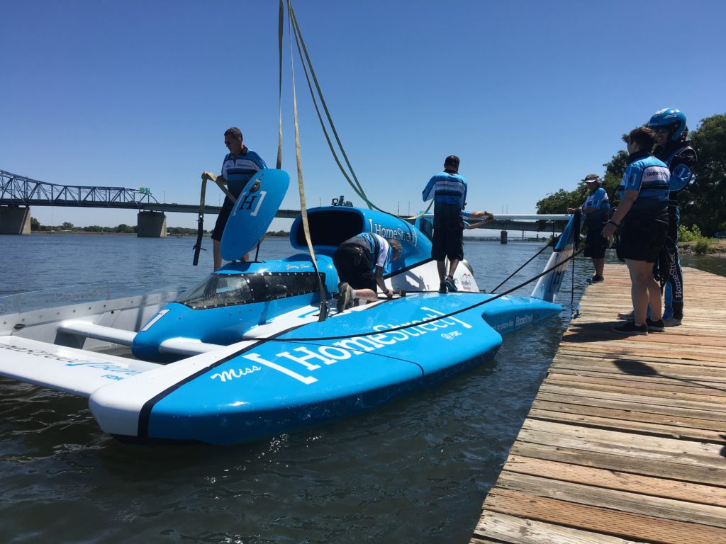 Hydroplane being taken out of the water.