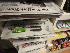 Various newspaper at a news stand