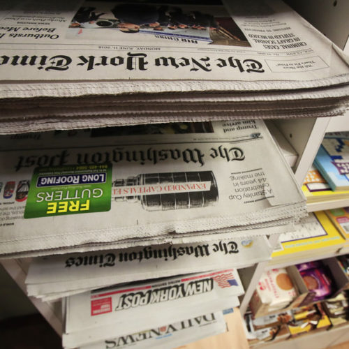 Various newspaper at a news stand