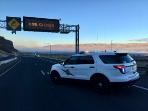 Washington State Patrol vehicle blocks Interstate 90 at Vantage during the Ryegrass Coulee Fire, July 10, 2018