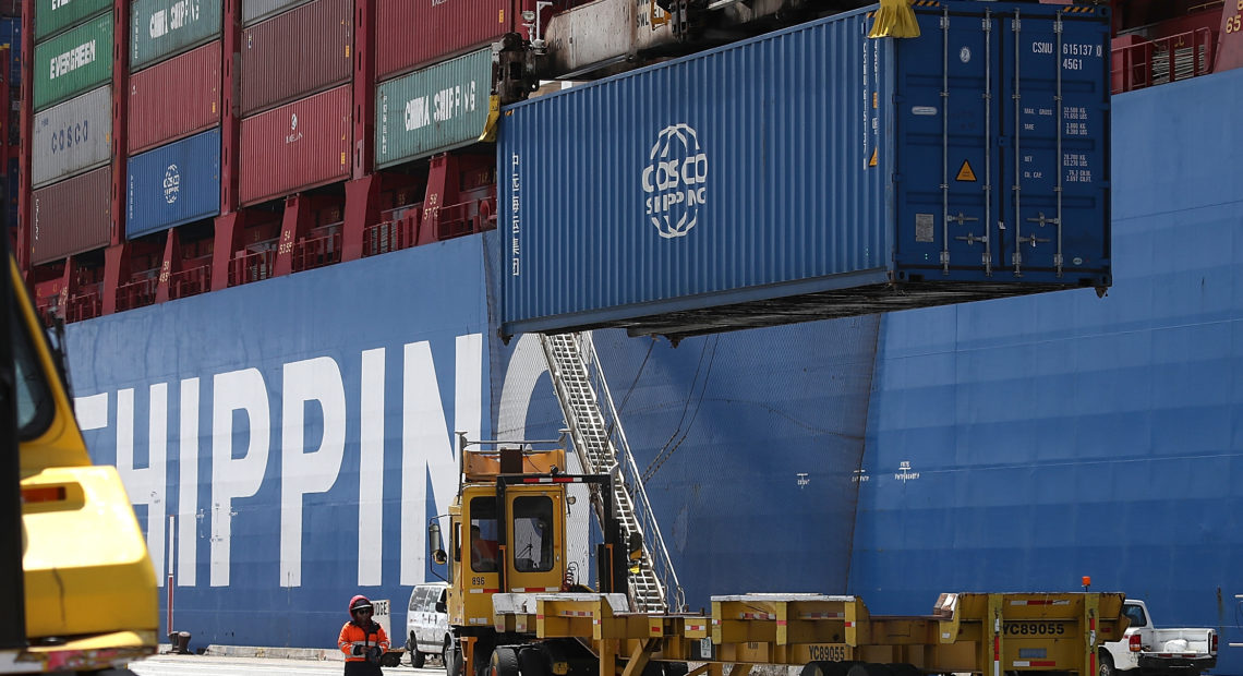 A shipping container is offloaded from the Hong Kong-based ship in Oakland, Calif., last month. CREDIT: Justin Sullivan/Getty Images