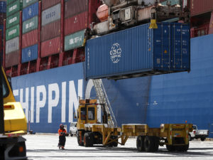 A shipping container is offloaded from the Hong Kong-based ship in Oakland, Calif., last month. CREDIT: Justin Sullivan/Getty Images