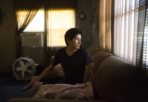Angel waits for his father to get home from work. Elissa Nadworny/NPR