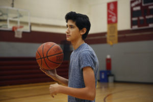 If the North Dakota harvest wraps up in time, Angel plans to try out for his Texas high school's basketball team. Elissa Nadworny/NPR