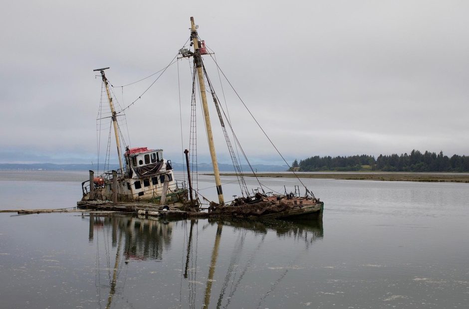 R/V Hero, a 125-foot wooden-hulled Antarctic research vessel, sank in March 2017 on the Palix River near Bay Center, Washington. Built in 1968, she was fitted with sails and labs for wildlife research but now poses a threat to oysters, other wildlife and navigation. CREDIT: MATT M. MCKNIGH