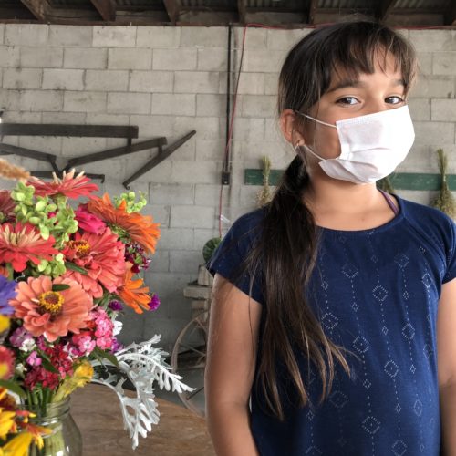 Kamila Zaragoza, 9, of Pasco, says the smoke has cut her playtime short. And she has to wear a mask when she works and waits at a food truck and farmstand with her mother and father. CREDIT: ANNA KING/N3