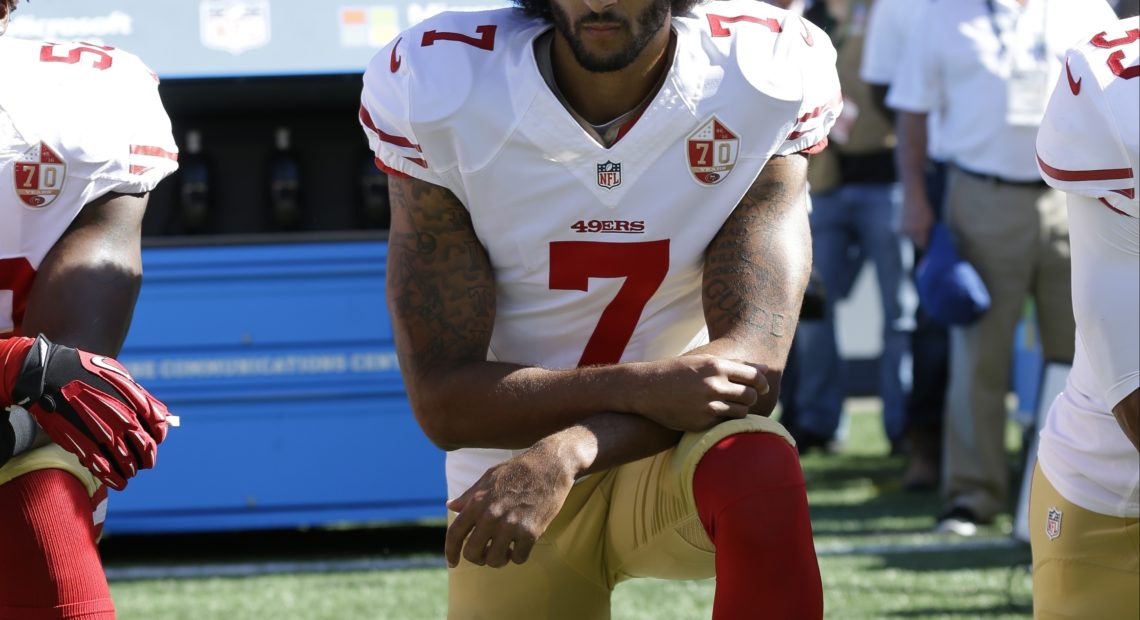 San Francisco 49ers' Colin Kaepernick kneels during the national anthem before an NFL football game against the Seattle Seahawks, in Seattle, in September 2016. Ted S. Warren/AP
