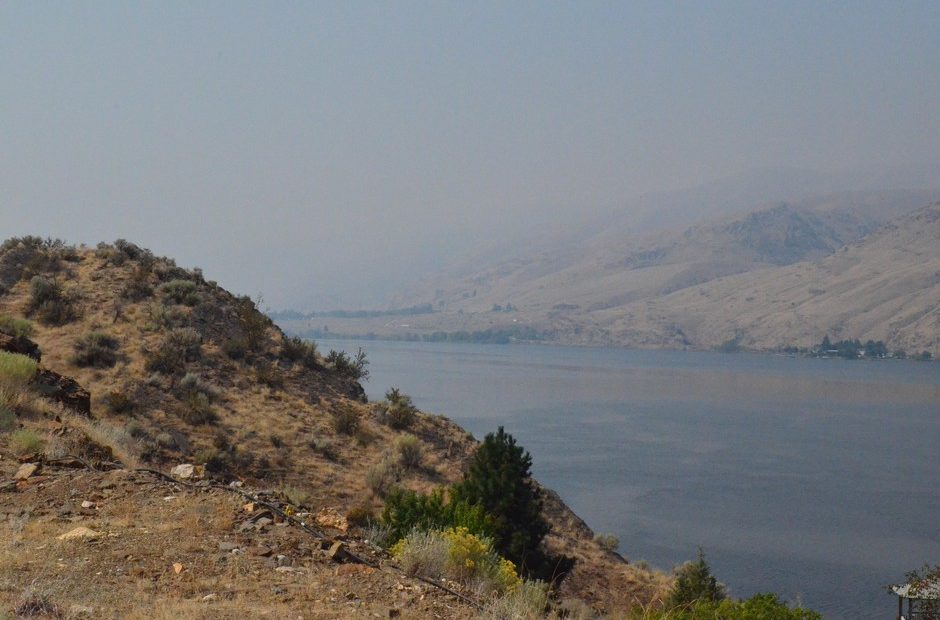 A hazy sky over the Columbia River in Eastern Washington. Fire seasons are now 105 days longer in the western U.S. than they were in the 1970s. That’s one reason smoky skies are more common during wildfire season than in the past. CREDIT: EILIS O'NEILL