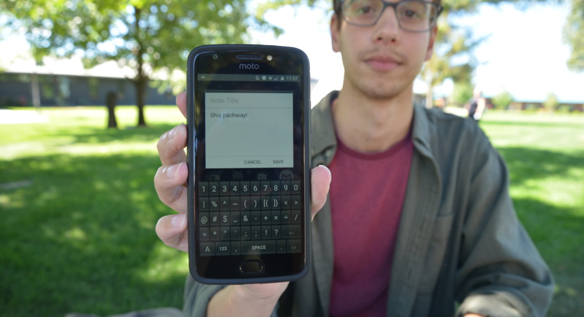 Keegan Livermore types out “Good afternoon” on the Ichishkíin-English keyboard he created. The app is available on the Google Play store for Android users only at this time. He hopes to have an iOS version later this fall. CREDIT: ESMY JIMENEZ/NWPB