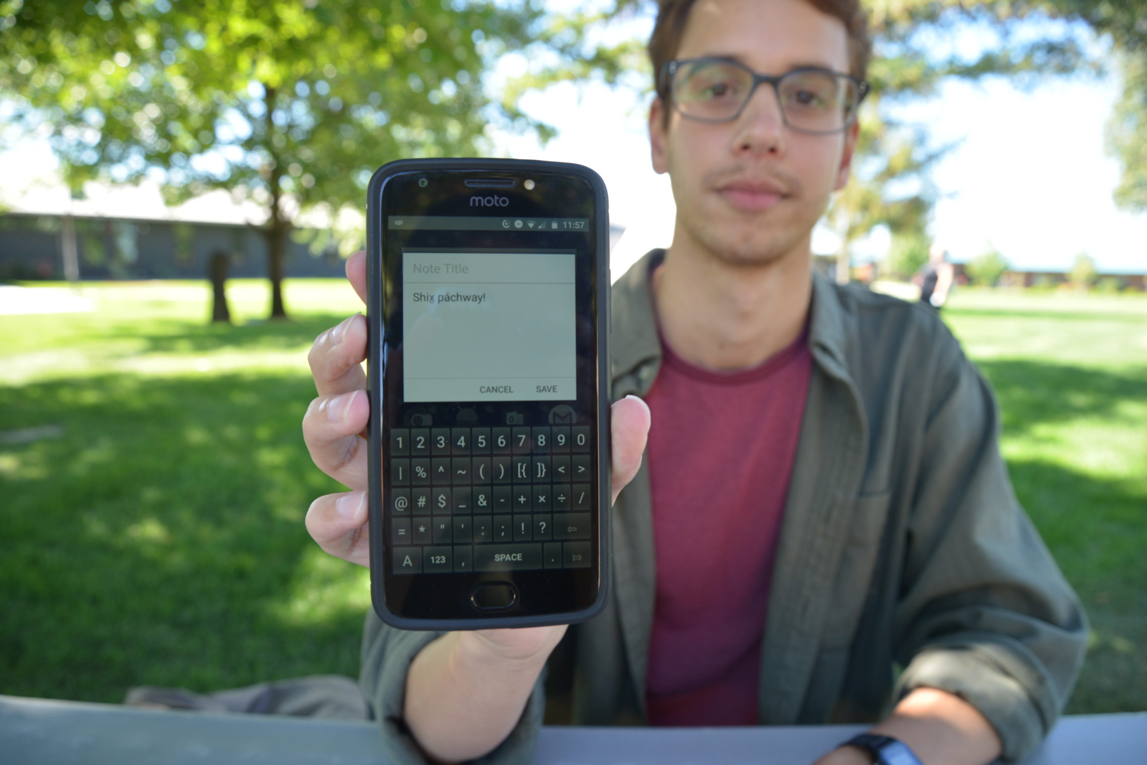 Keegan Livermore types out “Good afternoon” on the Ichishkíin-English keyboard he created. The app is available on the Google Play store for Android users only at this time. He hopes to have an iOS version later this fall. CREDIT: ESMY JIMENEZ/NWPB