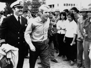 John McCain is escorted by Lt. Cmdr. Jay Coupe Jr. to Hanoi's Gia Lam Airport on March 14, 1973, after 5 1/2 years as a prisoner of war. Horst Faas/AP