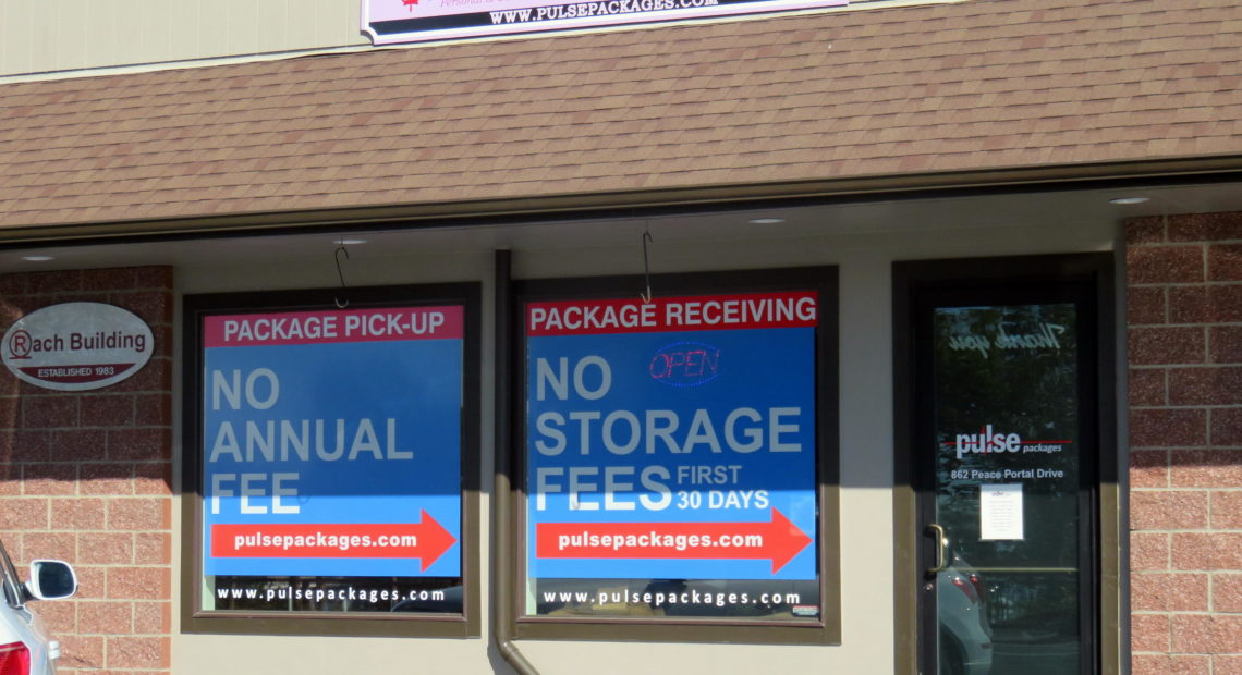 A steady stream of cars with British Columbia license plates stop by the Pulse Packages storefront just off the interstate in Blaine. CREDIT: TOM BANSE